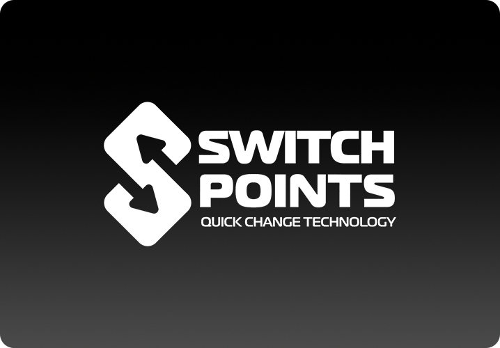 Das Bild zeigt das Winmau SwitchPoint Logo. Es handelt sich um ein grafisches Markenzeichen.