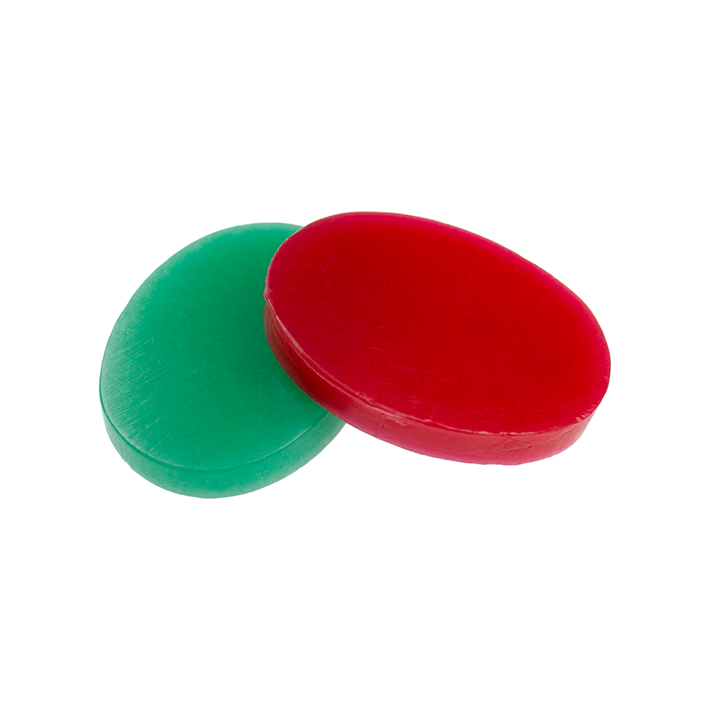 604_Fingerwachs_3 Auf dem Bild sind zwei ovale Wachsplatten in den Farben Rot und Grün zu sehen. Es handelt sich um das Produkt "Fingerwachs".