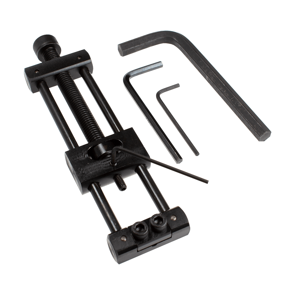 Dieses Bild zeigt den Designa Dart Repointer Black Pro Edition - Spitzenwechsler. Es handelt sich um ein Werkzeug zum Austausch von Dartspitzen in schwarzem Design.