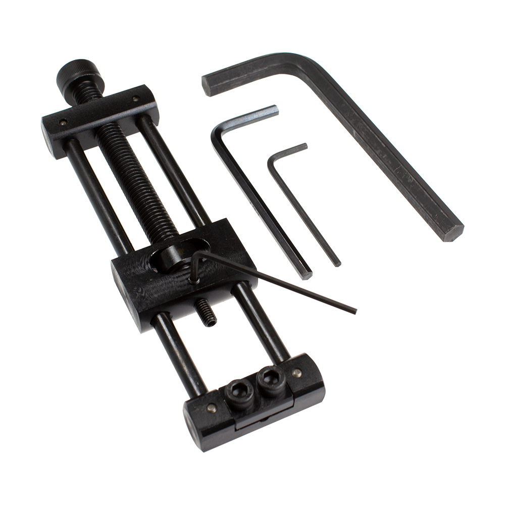 Designa Dart Repointer Black Pro Edition - Tip Changer Dieses Bild zeigt den Designa Dart Repointer Black Pro Edition - Spitzenwechsler. Es handelt sich um ein Werkzeug zum Austausch von Dartspitzen in schwarzem Design.