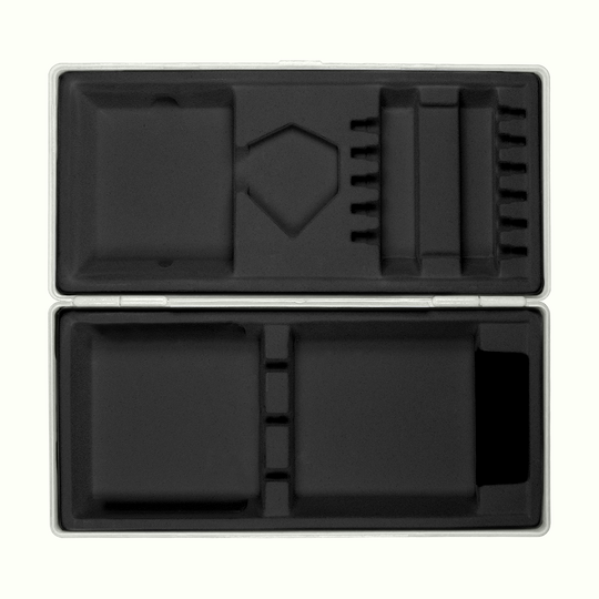 ABS box with custom print Die Abbildung zeigt eine geöffnete graue Box mit passgenauen Fächern aus schwarzem Schaumstoff. Die Box liegt auf einem hellgelben Hintergrund.