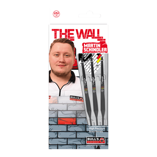 Bulls Martin Schindler The Wall Black Brass Steeldarts Auf dem Bild ist die Verpackung der "Bulls Martin Schindler The Wall Black Brass Steeldarts" zu sehen. Auf der Vorderseite sind das Produkt, ein Porträt von Martin Schindler und das Markenlogo abgebildet.