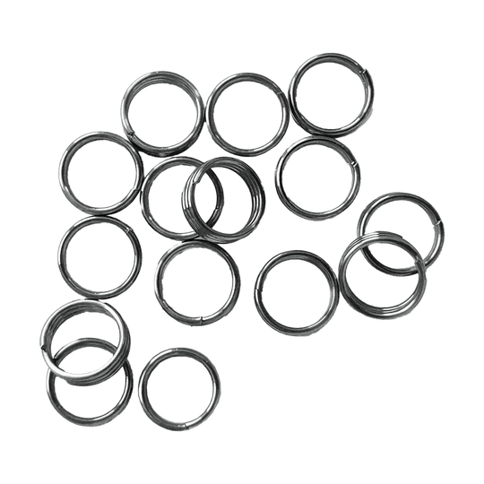 McDart Shaftringe - 5 Sets Auf dem Bild sind mehrere silberne Ringe zu sehen, die sogenannten McDart Shaftringe. Es handelt sich dabei um 5 Sets, die als Zubehör für Dartpfeile verwendet werden.