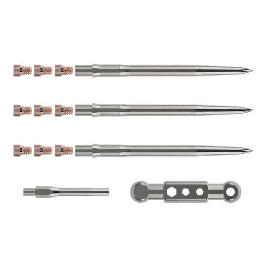 Caliburn Starter Kit Das Bild zeigt das Caliburn Starter-Kit mit mehreren metallischen Komponenten. Zu sehen sind lange, spitze Stäbe, kleine Schrauben sowie zwei weitere Werkzeugteile.